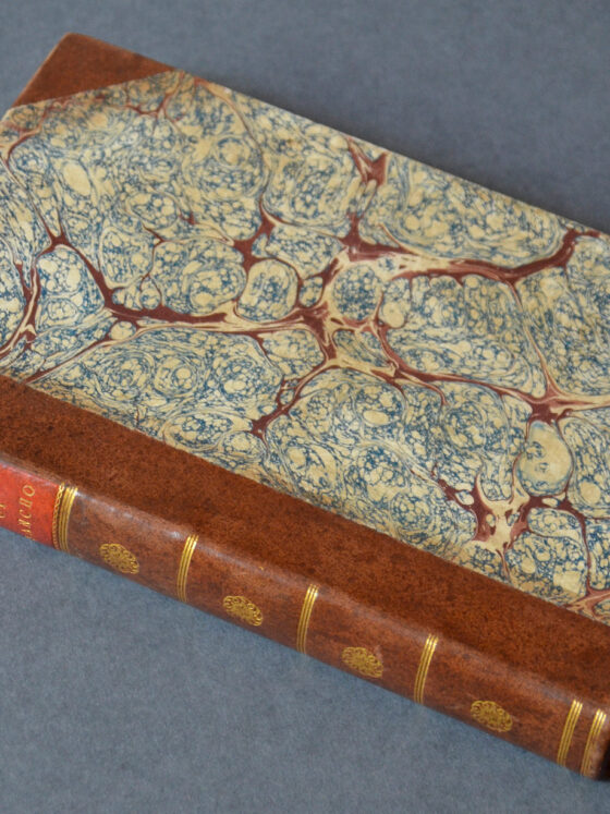 A book, "Letters of Sancho" rests on a gray background. It features marble patterns on the front, and mahogany-like patterns on the binding and corners.